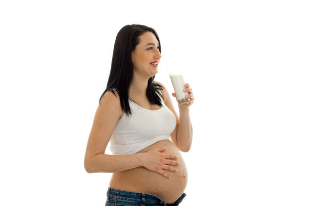 保健年轻漂亮的怀孕的黑发女人在白色的墙上摆着孤立的姿势美丽健康人