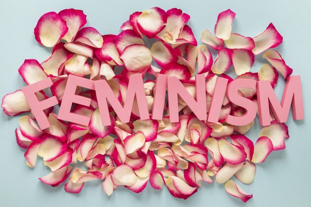 平面图玫瑰花瓣上的女权主义这个词庆祝欣赏妇女节