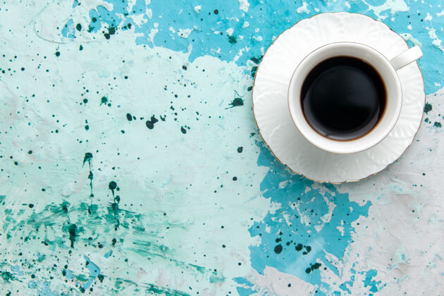 咖啡顶视图一杯咖啡热饮浓饮淡蓝色背景喝咖啡可可睡眠彩照洗衣机顶部可可