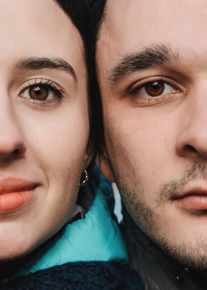 情人节半张脸的男人和女人看着相机的特写镜头护理魅力欲望