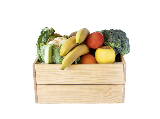 新鲜不同的水果和蔬菜在木箱里 隔离在白色上花椰菜盒子木材