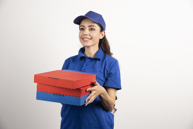 拿着专业送货员穿着蓝色制服送比萨饼高质量的照片送货工人女人