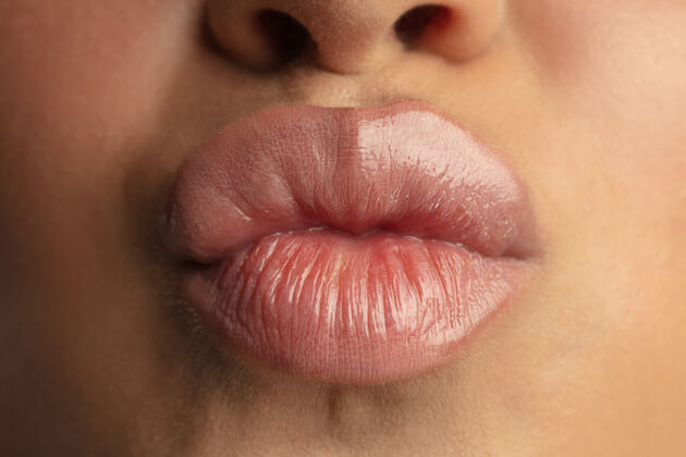 皮肤美丽女性嘴唇的特写镜头模特面部成人