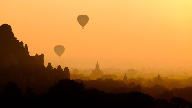 城市亚洲城市景观剪影与热气球热气球缅甸异国情调