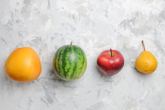 多汁俯视图白色背景上的水果 梨 苹果和西瓜西瓜食品饮食