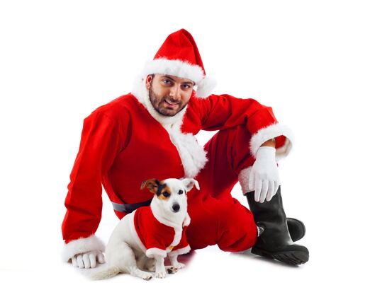 服装圣诞老人和他的小狗在白墙上狗窝圣诞老人伪装