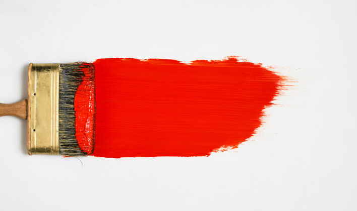 绘画用红色油漆刷在白色表面 顶视图 工作前的油漆样品 油漆的选择化妆条纹标题