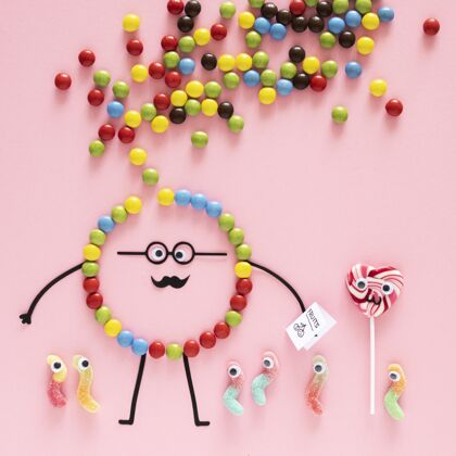 棒棒糖在粉红色背景上俯瞰糖果感觉粉色背景食物