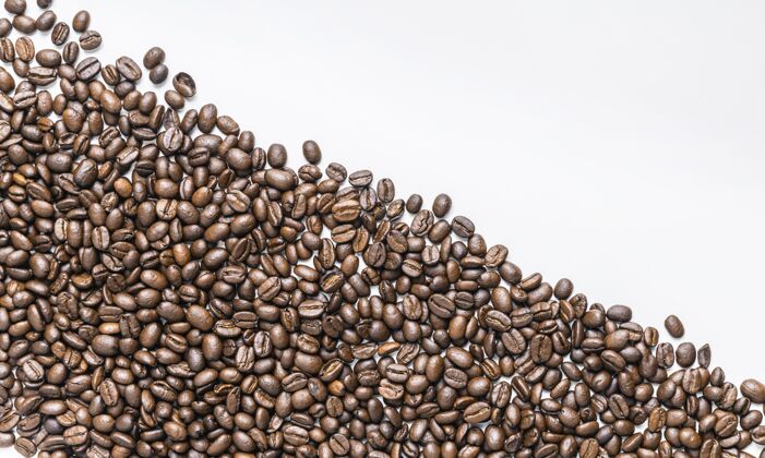 咖啡豆平铺的咖啡豆与复制空间顶部视图平面空间