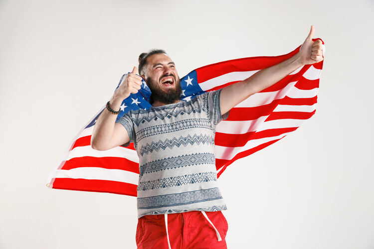 星星拿着美国国旗的年轻人独立年轻七月