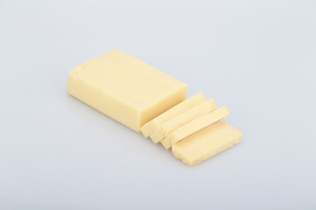 食物高角度拍摄的一块黄油隔离在一个白色的背景烹饪零食切